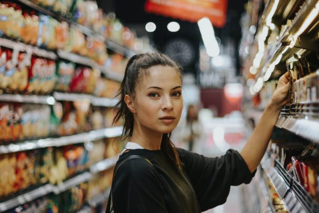 Gen Z shopping behaviour - girl shopping in a grocery store